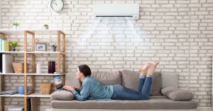Woman Keeping Cool with a Ductless Air Conditioner
